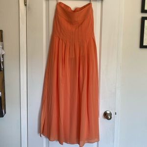 Orange Anthropologie pleated maxi skirt